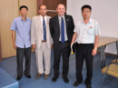 Unidentified North Korean telecommunications ministry officials flank Manuel German, EA7AJR (second from left), and Tony Gonzales, EA5RM, during a visit to Pyongyang, North Korea.